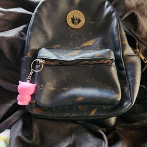 Disney Black and Gold Backpack with Pink Charm